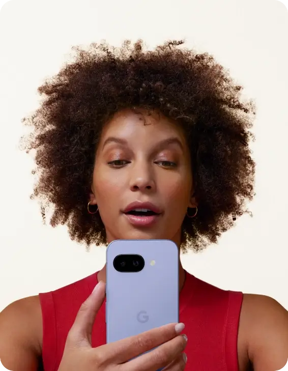 Woman looking at her Google Pixel 9a